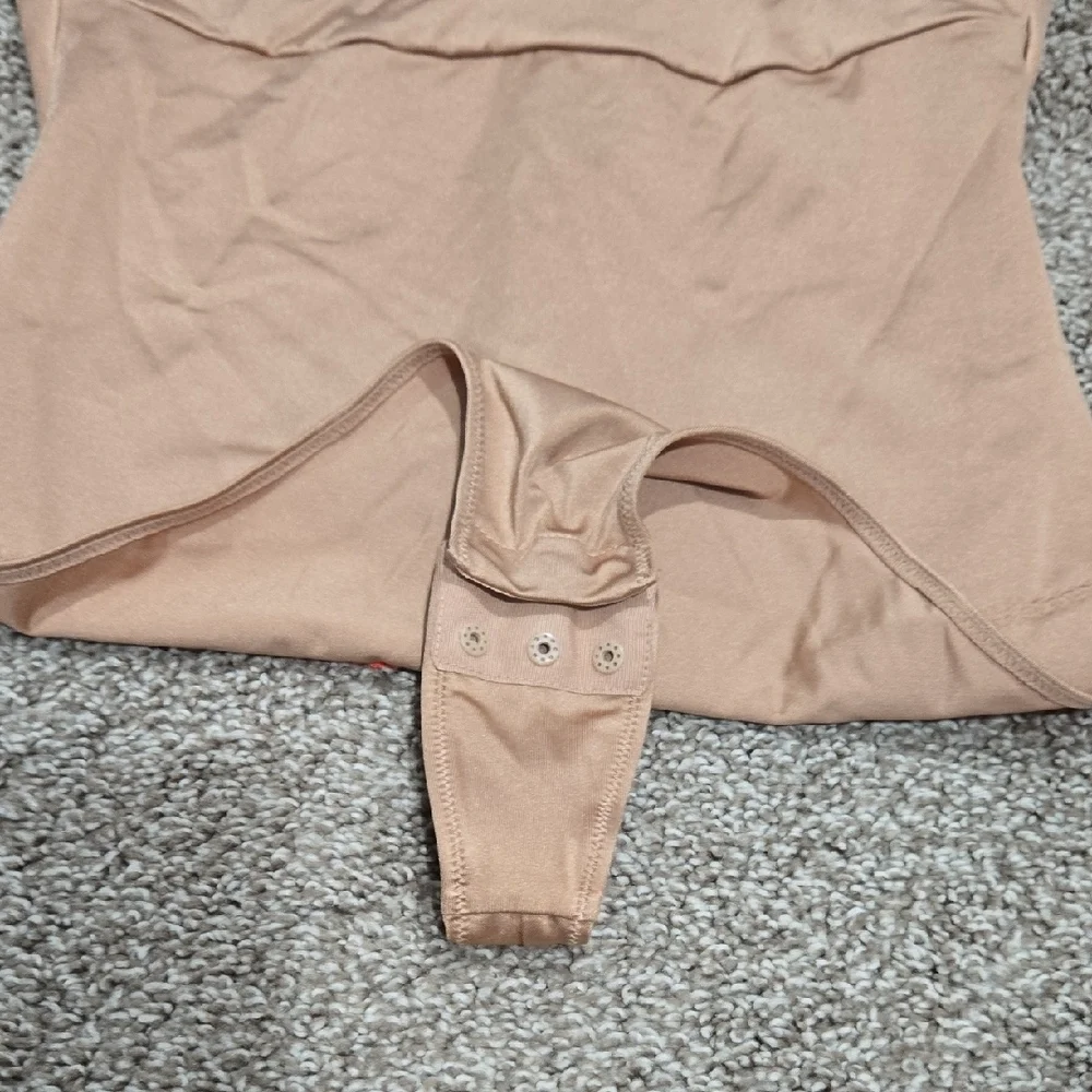 Yitty Headliner Shaping Open-Bust Thong Bodysuit in the Brown Sugar colorway.